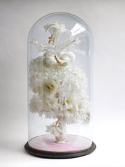 A magnificent and very large Victorian dome of beautiful feather work, housing a tree with flowers, balls, a bird and a stalk carrying a baby, all created out of intricate wire-work and white feathers.