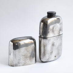 A good-looking Edwardian silver plated hip flask with a screw-cap top by "James Dickson & Sons Sheffield".  This one is super-large and has a particularly striking pared-back design. The upper half has a detachable silver plated EPNS cover that also acts as a cup.