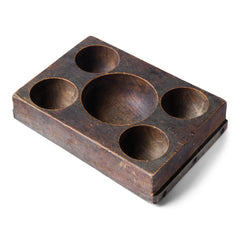 A very handsome Edwardian coin organiser that would have once stood on a grocery store counter - as a handy dispenser for small change. Carved from a single block of oak, with three hollowed-out half-spheres, it has been&nbsp;polished smooth from its years of use, and has developed a wonderful hand-worn patina. Its shop work days may be over, yet it still makes a great organiser - for change, keys, or for all those bits and pieces that accumulate in the kitchen or on the desk.