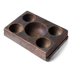 A very handsome Edwardian coin organiser that would have once stood on a grocery store counter - as a handy dispenser for small change. Carved from a single block of oak, with three hollowed-out half-spheres, it has been polished smooth from its years of use, and has developed a wonderful hand-worn patina. Its shop work days may be over, yet it still makes a great organiser - for change, keys, or for all those bits and pieces that accumulate in the kitchen or on the desk.
