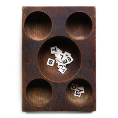 A very handsome Edwardian coin organiser that would have once stood on a grocery store counter - as a handy dispenser for small change. Carved from a single block of oak, with three hollowed-out half-spheres, it has been polished smooth from its years of use, and has developed a wonderful hand-worn patina. Its shop work days may be over, yet it still makes a great organiser - for change, keys, or for all those bits and pieces that accumulate in the kitchen or on the desk.