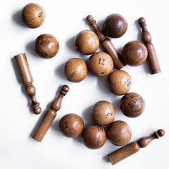 A collection of beautifully made antique numbered balls and skittles, each hand crafted from polished boxwood, and each a beautiful example of late 19th century treen.