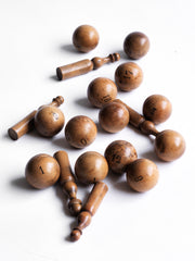 A collection of beautifully made antique numbered balls and skittles, each hand crafted from polished boxwood, and each a beautiful example of late 19th century treen.