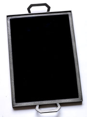 A stunning 1930s Art Deco black Vitrolite glass and hammered pewter tray. The rectangle of black glass is mounted flush in a pewter frame that is held by a pair of art deco shaped pewter handles.