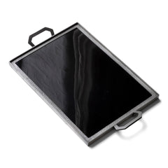 A stunning 1930s Art Deco black Vitrolite glass and hammered pewter tray. The rectangle of black glass is mounted flush in a pewter frame that is held by a pair of art deco shaped pewter handles.