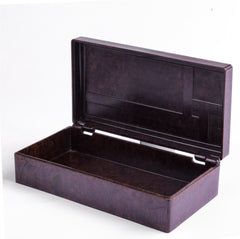 A striking 1930s Bakelite box with a hinged lid applied with a press-moulded modernist motif, and with "Made in England" to its underside. Its stepped and streamlined rounded edges make it a good example of early twentieth century Art Deco influenced Modernism.