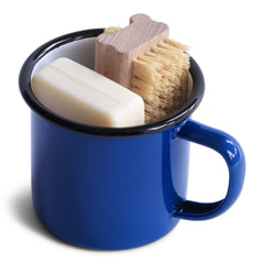 A nail brush and a bar of our utility soap all neatly tucked into our blue enamel mug makes for a thoroughly useful gift. The mug is ideal for holding your toothbrush and toothpaste - or for that night-time drink of water - and will make a smart addition to your bathroom.