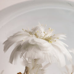 Detail of a magnificent and very large Victorian dome of beautiful feather work, housing a tree with flowers, balls, a bird and a stalk carrying a baby, all created out of intricate wire-work and white feathers.