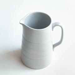 A good early twentieth century ironstone water jug with incised banding