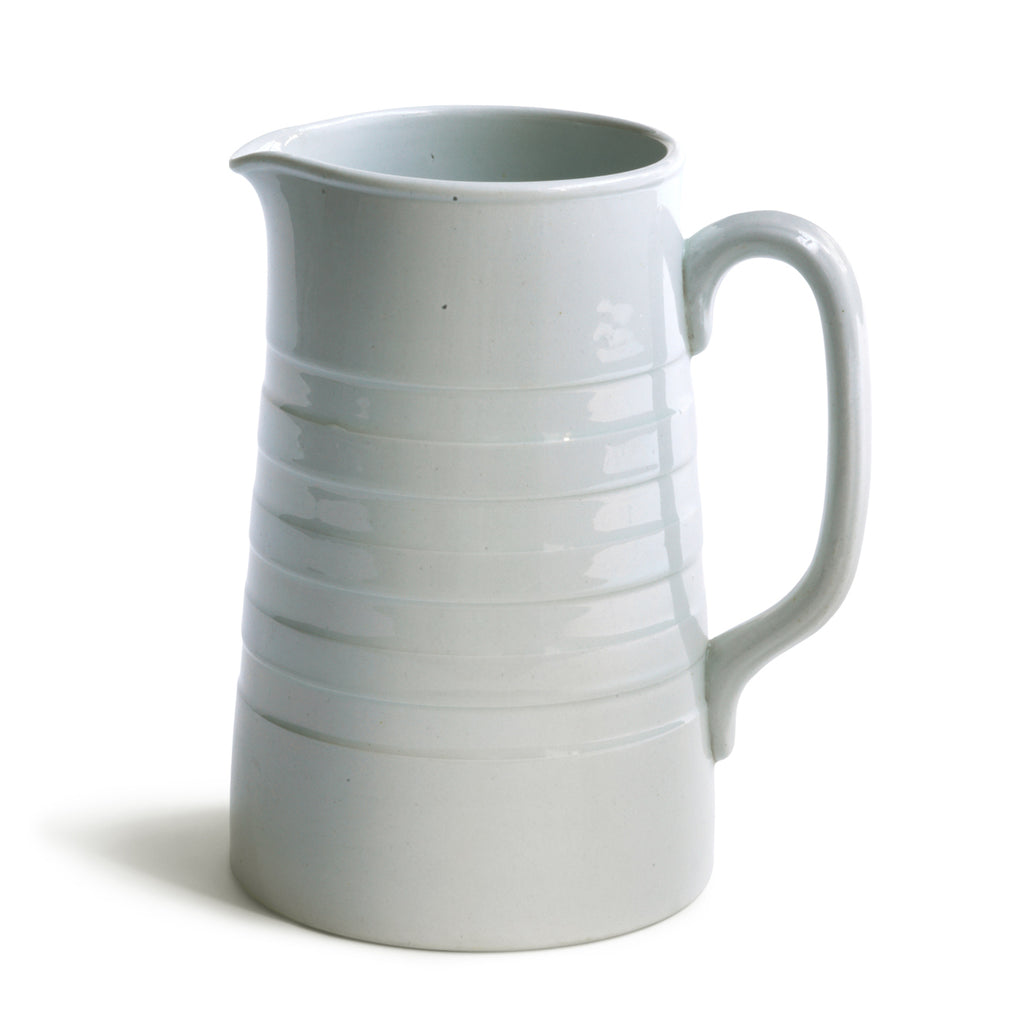 A good early twentieth century ironstone water jug with incised banding