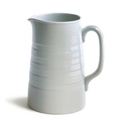 A good early twentieth century ironstone water jug with incised banding