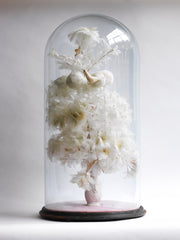 A magnificent and very large Victorian dome of beautiful feather work, housing a tree with flowers, balls, a bird and a stalk carrying a baby, all created out of intricate wire-work and white feathers.