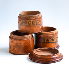 A beautiful Victorian treen three-tier spice tower with fine historical patina, and complete with its original labels "Ginger" and "Cinnamon". It consists of three containers, each screwing into the one below, and a truly elegant architectural screw-on lid.