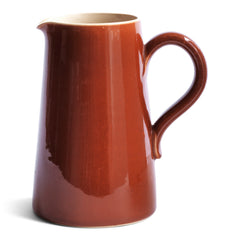 A large and rather handsome water jug in a rich toffee-brown glaze manufactured by Lovatts, and stamped "Lovatts" to its underside.