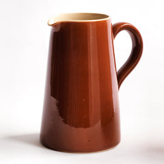 A large and rather handsome water jug in a rich toffee-brown glaze manufactured by Lovatts, and stamped "Lovatts" to its underside.