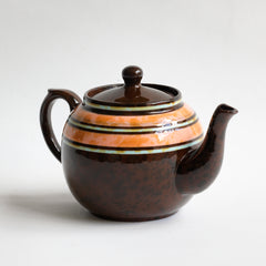 A very pretty 1930s 2 - 3 cup original Brown Betty teapot with peach, butterscotch and sky-blue marbled banding.