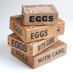 A collection of charming 1940s World War II home front egg postal boxes. The lids, end panels and/or front panels are all stencilled "Eggs". They would have been used to post eggs from the farm to the customer during WWII.