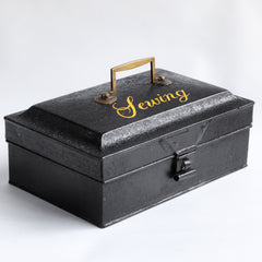 A charming Victorian tin with "Sewing" sign-written in yellow-gold italic font to its lid. Perfect for the storing of all your sewing bits and pieces - from braids and cottons, to scissors, needles and buttons. It has an elegant brass carrying handle, and a hasp, and the lid is beautifully chamfered on all sides.