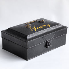A charming Victorian tin with "Sewing" sign-written in yellow-gold italic font to its lid. Perfect for the storing of all your sewing bits and pieces - from braids and cottons, to scissors, needles and buttons. It has an elegant brass carrying handle, and a hasp, and the lid is beautifully chamfered on all sides.