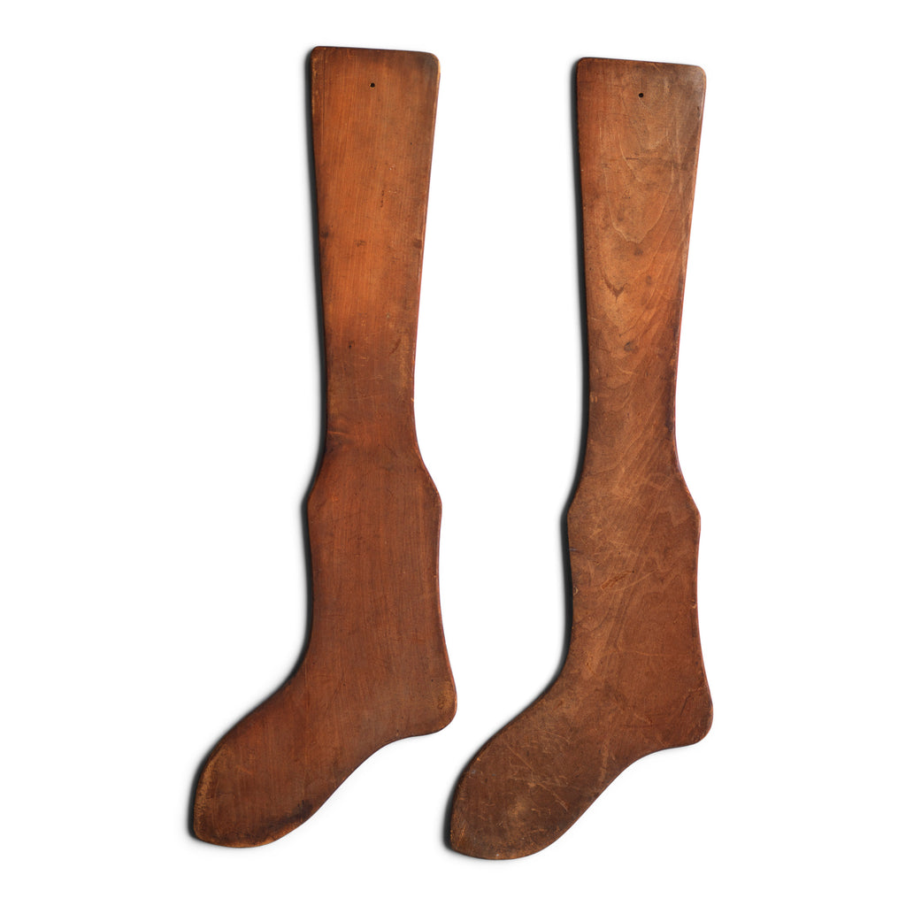 A pair of antique wooden stocking or sock stretchers - very visual, almost Shaker in their appeal, and great for a wall.