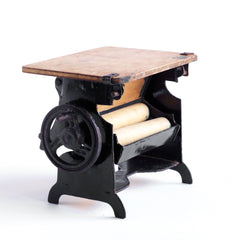 A charming Edwardian miniature doll's house mangle.