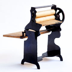 A charming Edwardian miniature doll's house mangle.