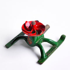 A 1930s 12/- "Centribine" lawn sprinkler, "British Made" stamped into the iron base. The sprinkler is in full working order and only requires attaching to the end of a garden hose - once turned on, the water pressure causes the sprinkler to spin round, the jets watering the garden in an even circle.