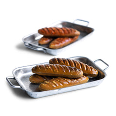 A charming collection of vintage doll's house bloomer style loaves with slashed baked tops; a set of aluminium baking / roasting pans with handles; and a fat little burnished roast chicken - all with their original painted finish, and modelled from a composition plaster material.