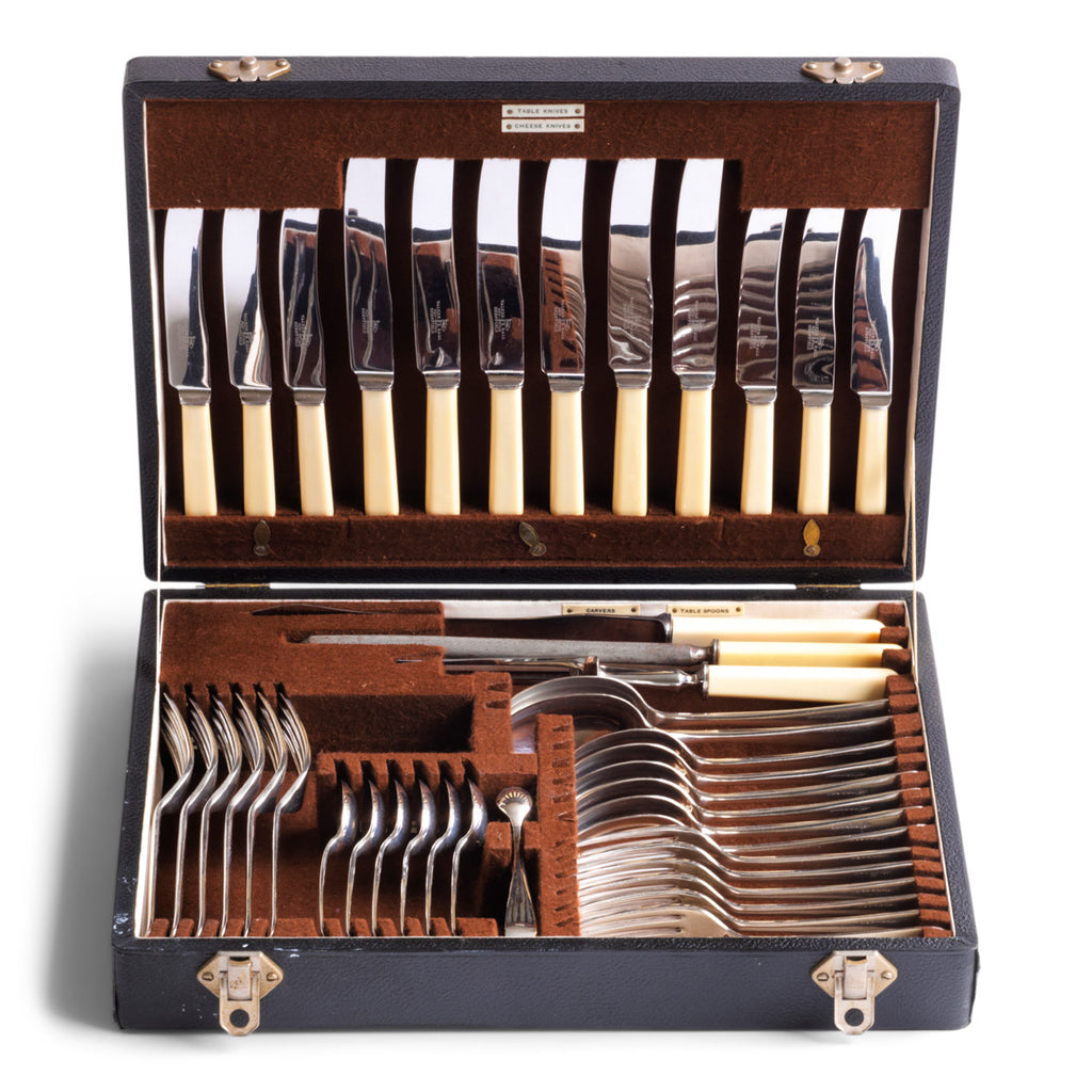 A good-looking silver plated 40 piece canteen of cutlery by Walker & Hall, Sheffield, c.1930, and in its original brown felt lined box.  The box's sections are each labelled: Table Knives; Cheese Knives; Table Forks; Dessert Forks; Dessert Spoons; Sugar Tongs; Tablespoons; Carvers; and Steel. The set is for 6 people.