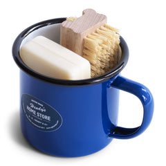 A nail brush and a bar of our utility soap all neatly tucked into our blue enamel mug makes for a thoroughly useful gift. The mug is ideal for holding your toothbrush and toothpaste - or for that night-time drink of water - and will make a smart addition to your bathroom.
