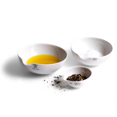 These perfectly formed vintage porcelain pouring dishes are the perfect kitchen-to-table vessels for olive oil, sea salt and crushed black pepper. Once used in a chemist's laboratory, they are now perfectly suited for condiments at the dining table.  