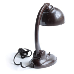 1930s Bakelite lamp designed by British designer Eric Kirkman Cole. It has a pivoting arm and adjustable shade for directional lighting making it ideal for the desk or the bedside table.