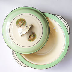 A glorious 1930s fish dinner service, complete with a large platter for serving a whole fish.  Each piece is embellished with a fresh water fish, such as pike, perch and trout, and contained within a mint-green border. Each item is stamped "Woods Ivory Ware England" to its underside.