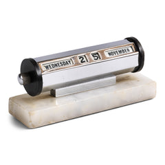 A super-cool 1930s chromium plated perpetual desk calendar mounted on a white alabaster base. The months are adjusted by swivelling the black Bakelite discs either end, and the date is changed by turning the chrome knobs either end. Dimensions: Length 23cm Depth 4cm Height 5.5cm Condition: excellent