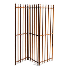 A particularly fine Arts & Crafts gated wooden screen consisting of three open panels.  Each panel is constructed from turned wooden spindles that pass through wooden crossbars - the whole resembling railings. Each spindle is topped with a turned acorn-shaped finial. The execution of the joinery and the pared-back design is pure Arts & Crafts.