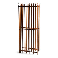A particularly fine Arts & Crafts gated wooden screen consisting of three open panels.  Each panel is constructed from turned wooden spindles that pass through wooden crossbars - the whole resembling railings. Each spindle is topped with a turned acorn-shaped finial. The execution of the joinery and the pared-back design is pure Arts & Crafts.  This image shows the screen folded.