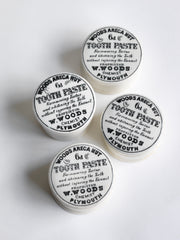 We have sourced a small collection of Victorian chemist's tooth paste pots with lids.  Each lid is exquisitely designed and bears all of the proprietor's information in black and white: "Woods Areca Nut 6d Tooth Paste - For removing Tartar and whitening the Teeth without injuring the Enamel. Propretor W. Woods Chemisy Plymouth"