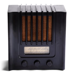The British Murphy 4 valve AD 94  radio with distinctive Art Deco black Bakelite cabinet was manufactured from 1940.  Looking like a modernist building, this pioneering architectural style  radio resembles a powerhouse of electronic communications. Its streamline, futuristic mirrors  the Machine Age of the late 1930s.