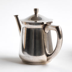 A good, heavy-duty German WMF silver plated teapot stamped "Wurtt Metall W Fabrik", an abreviation for Württembergische Metallwarenfabrik ( Württemberg metal factory), and "Geislingen Steig", the southern German town where the factory was based.  It also bears an arrow mark, indicating it was for military use - and was most probably made for an English officer's mess.