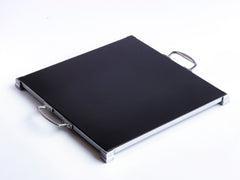 A stunning 1930s Art Deco black Vitrolite glass and chrome tray. The square of black glass is mounted flush in a chrome frame that sits on four stepped corner feet.  Most likely originally used as a cake presentation tray in a grand hotel dining room.