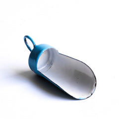 A miniature enamel flour scoop, part of an extensive collection of pale blue enamel miniature antique kitchen ware, previously owned by the miniaturist specialist and collector extraordinaire Joan Dunk; including, flour scoops, sieve, ewer, grater, saucepan, frying pan and a funnel.