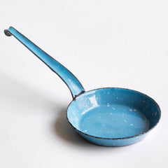 A miniature blue enamel frying pan, part of an extensive collection of pale blue enamel miniature antique kitchen ware, previously owned by the miniaturist specialist and collector extraordinaire Joan Dunk; including, flour scoops, sieve, ewer, grater, saucepan, frying pan and a funnel.