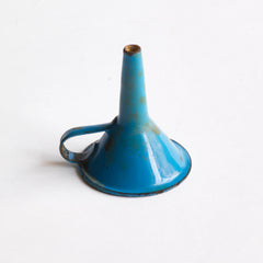 A miniature blue enamel funnel, part of an an extensive collection of pale blue enamel miniature antique kitchen ware, previously owned by the miniaturist specialist and collector extraordinaire Joan Dunk; including, flour scoops, sieve, ewer, grater, saucepan, frying pan and a funnel.
