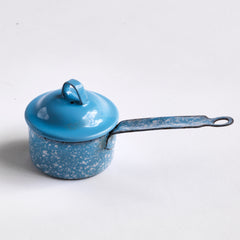 A miniature white speckled blue enamel saucepan with blue lid; a large frying pan; and a long-handled sieve. Part of an extensive antique and vintage collection of miniature pale blue enamel kitchen ware, previously owned by the miniaturist specialist and collector extraordinaire Joan Dunk.