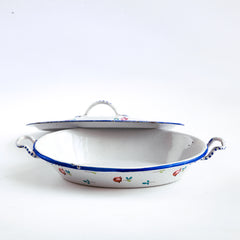 A wonderful, rare antique doll's enamel dinner service decorated with rose buds and leaf sprigs, and each piece finished with a blue trim; very much in tune with the current trend "cottage core", an aesthetic which celebrates an idealised rural life. This is part of an extensive collection of miniature enamel kitchen ware, previously owned by the late miniaturist specialist and collector extraordinaire Joan Dunk.