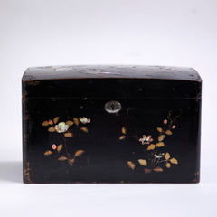 A charming 1920s Japanese lacquered tea caddy inlaid with mother of pearl flowers, leaf sprigs, vine trails, and birds. The bow-topped hinged lid opens up to reveal a further two lacquered boxes with hinged lids which are removable, as shown in the images. Length 23cm Depth 12.5cm Height 14cm.