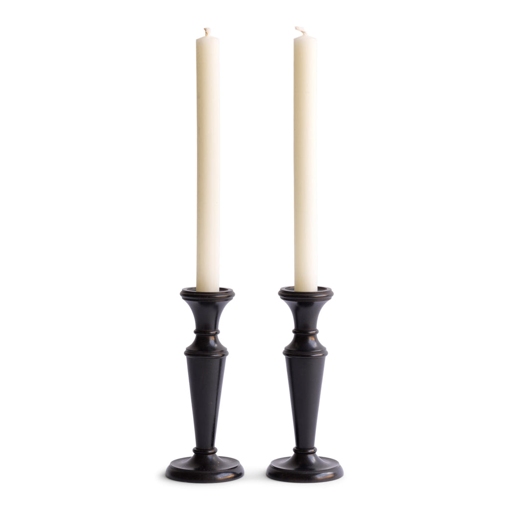A striking pair of Edwardian ebony candlesticks.