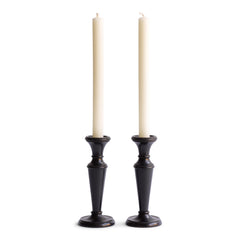 A striking pair of Edwardian ebony candlesticks.