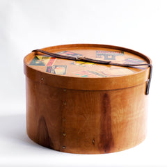 A very impressive Edwardian ply hat box with original luggage stickers, leather strap and cobalt blue interior. The stickers document the owner's grand tours of Italy and Egypt, from the Grand Hotel in Bologna to the Albergo Nazionale of Rome; and then in Egypt - the Hotel Cecil Alexandria, and the Luxor Winter Palace, to the Cataract Hotel of Assouan.