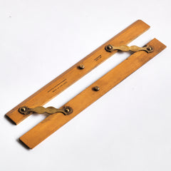 Draughtsman's parallel rule with brass hinges and imprinted with "Universal Wood Working Co Ltd Made in England - Warranted Best Box": £58 Length 31cm Width 5.5cm Thickness 0.5cm